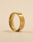 Gold ring on a beige background