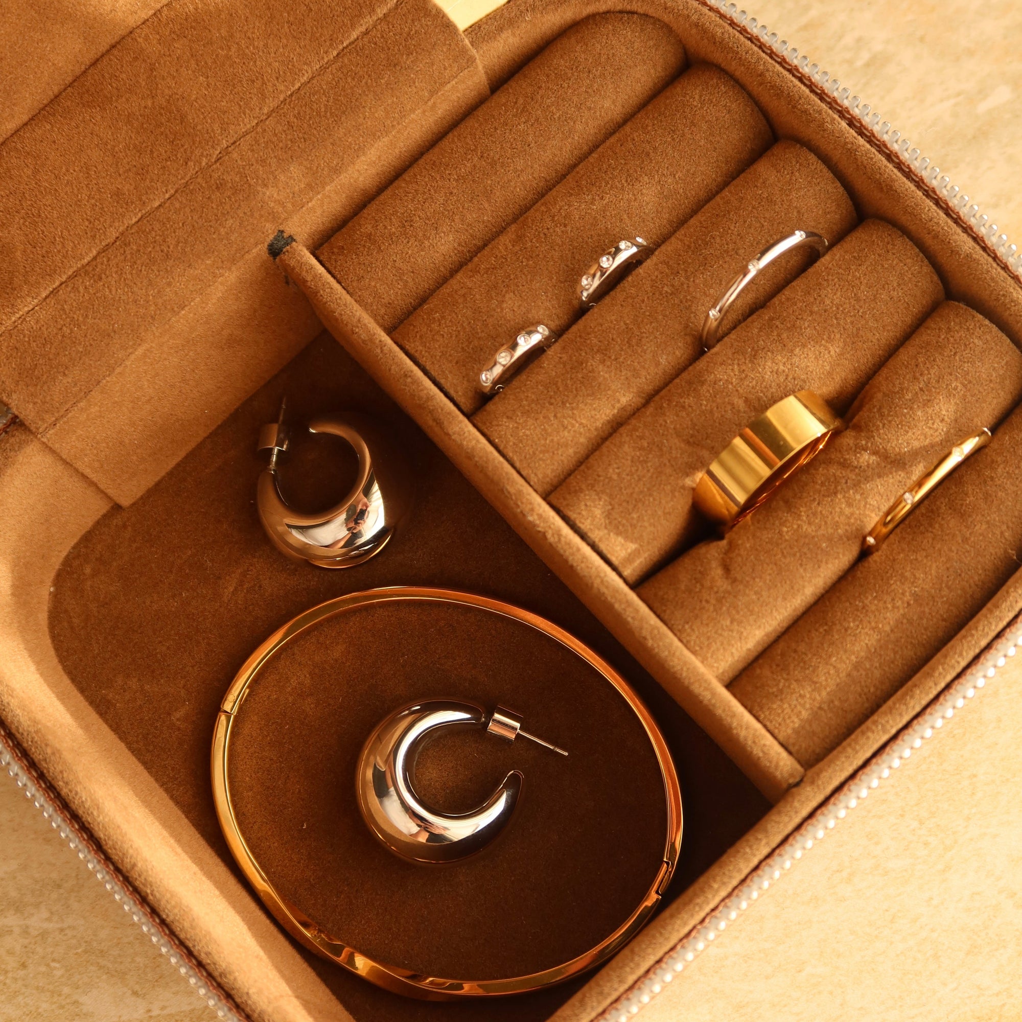 Day In May pieces in a brown jewellery box